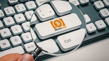 computer key with bitcoin cash logo