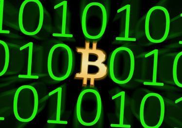 Bitcoin / Image showing a Bitcoin symbol in orange within a group of ones and zeros, depicting digital currency.