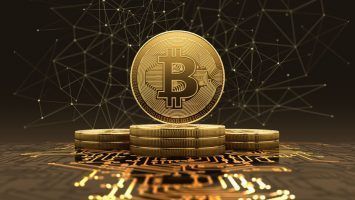 Golden bitcoins standing on circuit board, cryptocurrency concept. 3d illustration.