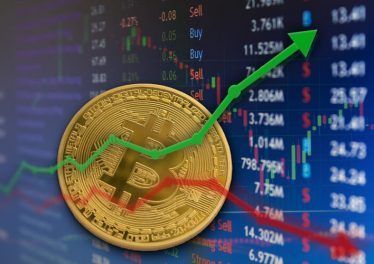 Bitcoin rising and falling in financial business market concept with charts.