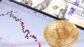 Apple iPhone 8+ and chart with bitcoin, dollars