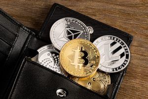 crypto currency coin in leather wallet on wide wood wooden background bitcoin ethereum litecoin iota ripple