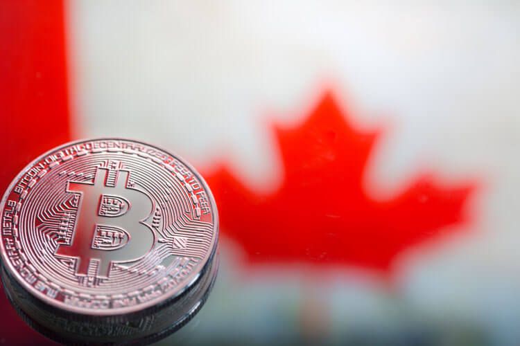coins Bitcoin, against the background of Canada flag, concept of virtual money, close-up. Conceptual image of digital crypto currency.