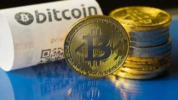 Bitcoin golden coins and paper receipt macro