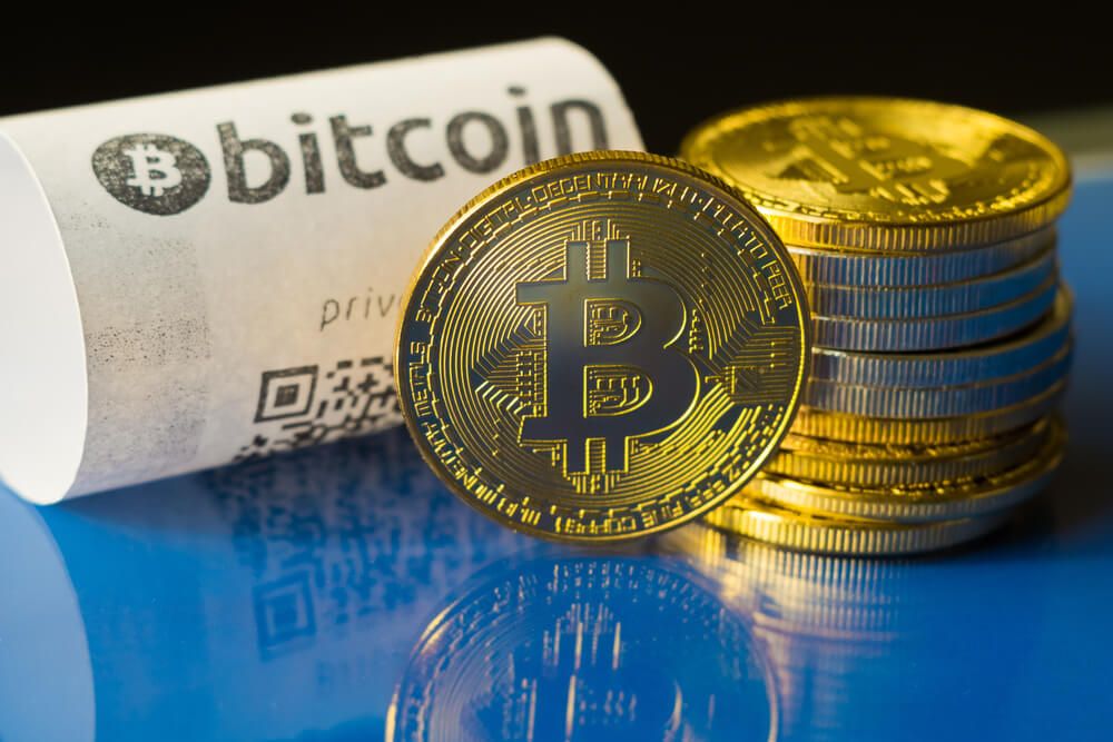 Bitcoin golden coins and paper receipt macro