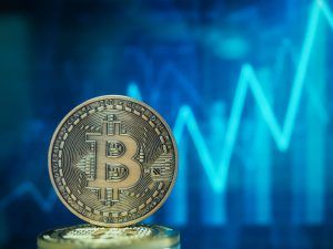 Bitcoin and rising chart in the background.