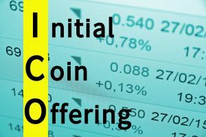 Text Initial coin offering, financial data visible on the background. 